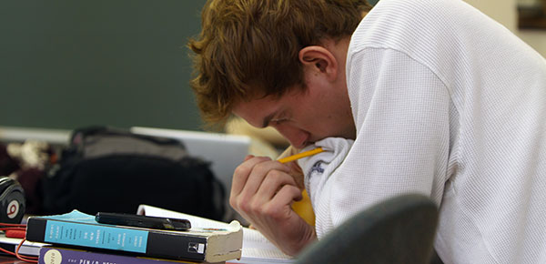 Student concentrating on his paper