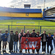 Class poses for a photo in front of the pitch at Boca Juniors' stadium.