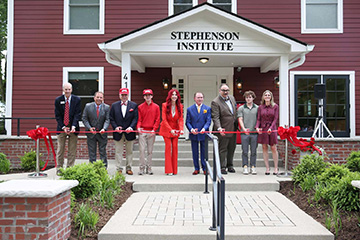 Richard J Stephenson '62, his wife, Dr. Stacie J. Stephenson, (fifth and six from left) and family members at the Stephenson Institute ribbon cutting ceremony in May 2024.