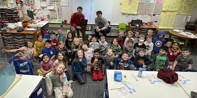 University of Louisville basketball players read books to children