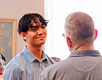 Nikolaz Cordova '28 (left) talks with Bobby Horton, WLAIP director and professor of psychology.