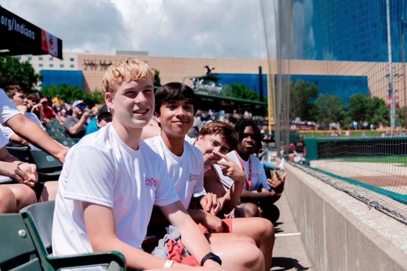 a group of people sitting on a bench