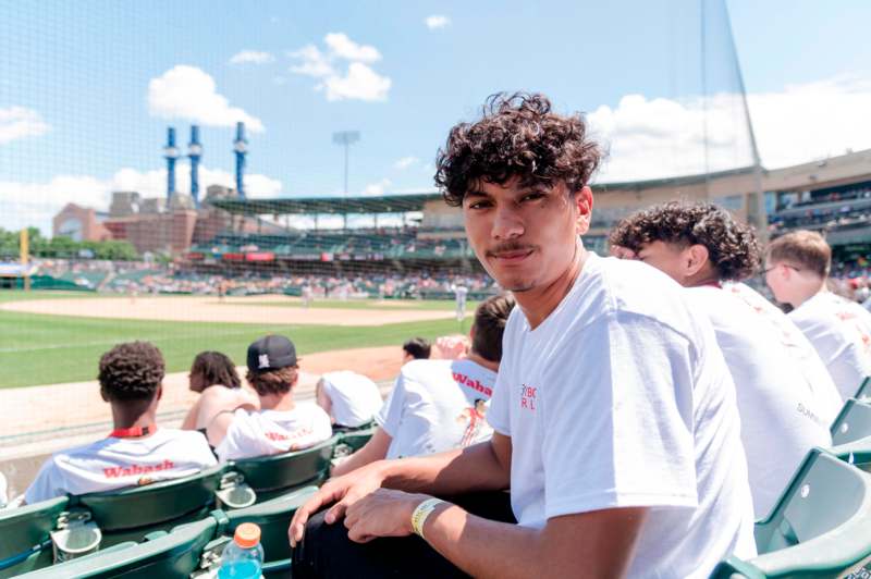 a man sitting in a stadium