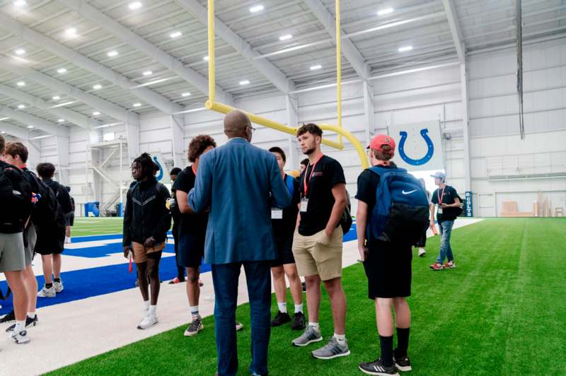 a group of people standing in a large building