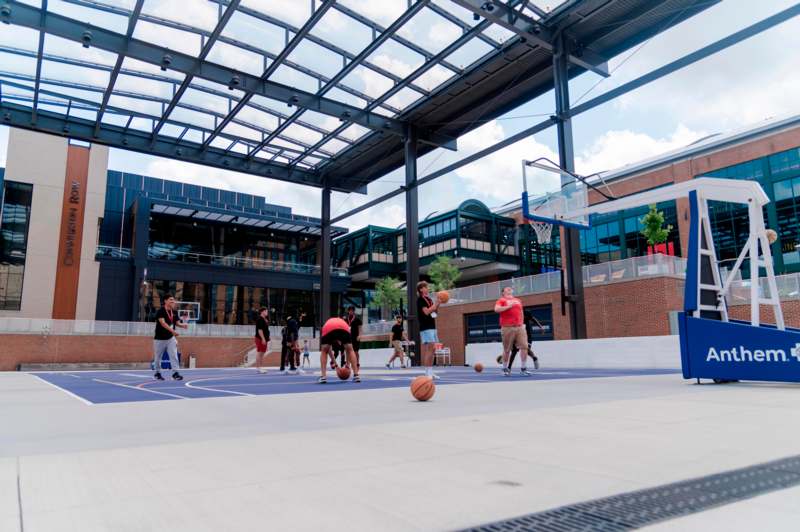 a group of people playing basketball