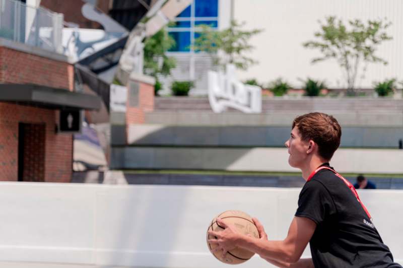 a man holding a basketball