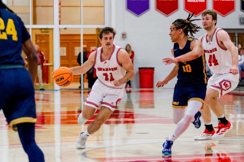 a group of men playing basketball