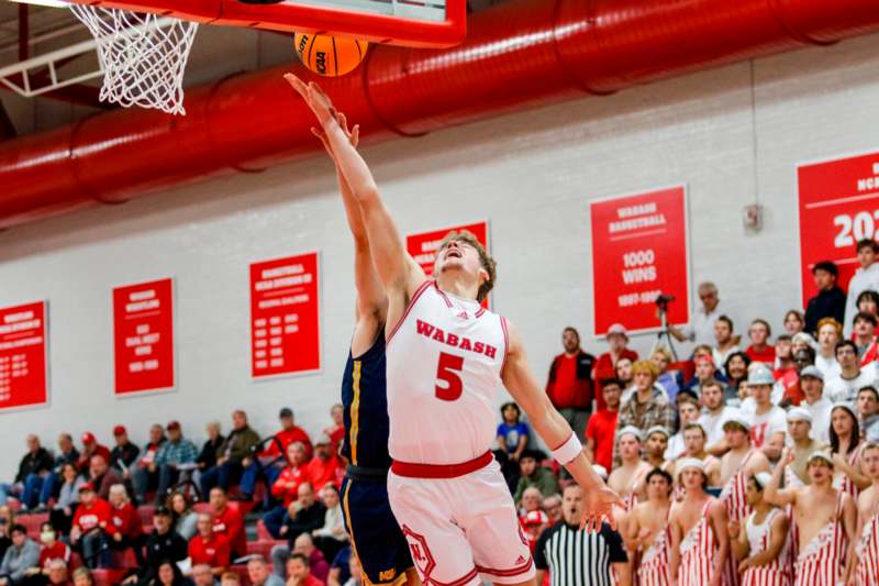 a basketball player dunking a ball