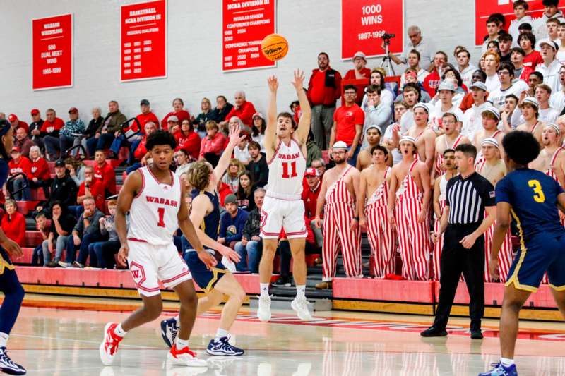 a group of people watching a basketball game