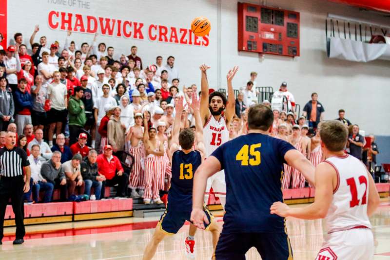 a group of people playing basketball