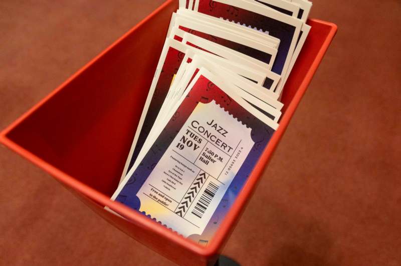 a red container with tickets in it