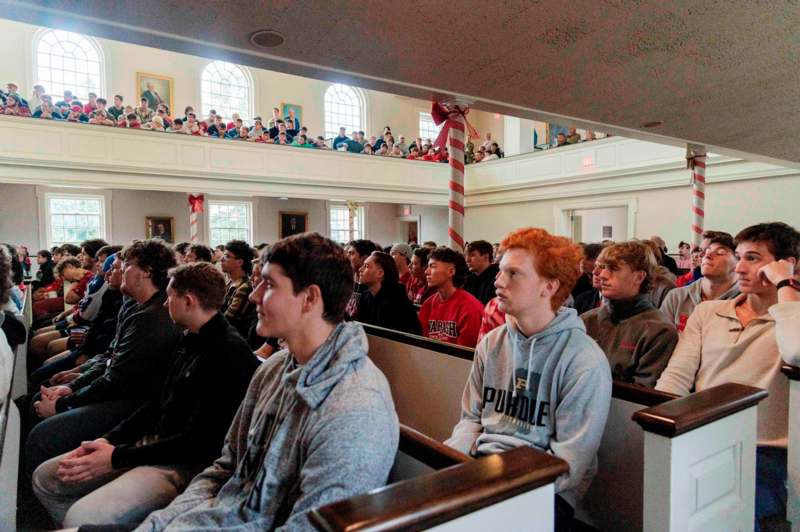 a group of people sitting in a church