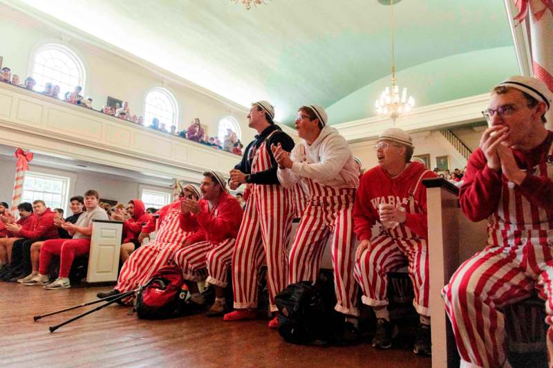 a group of people in striped pajamas