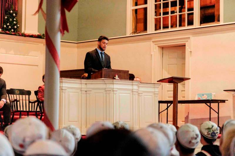 a man standing at a podium