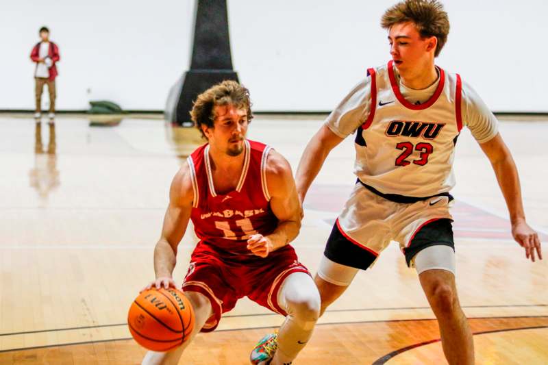 a group of men playing basketball