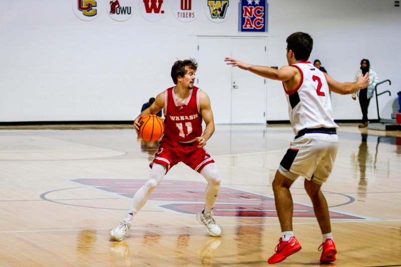 a basketball player dribbling a ball