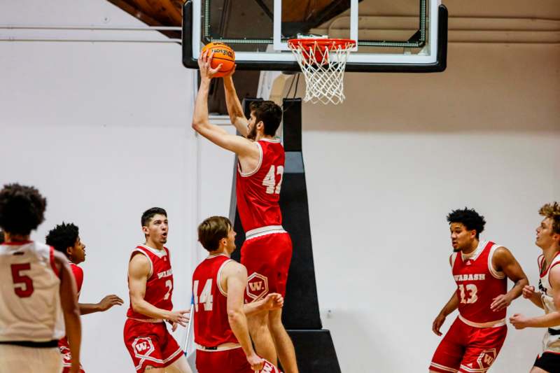 a group of men playing basketball