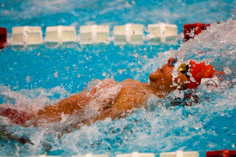 a person swimming in a pool