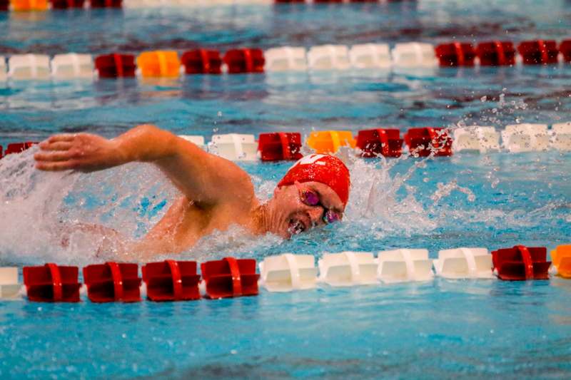 a man swimming in a pool