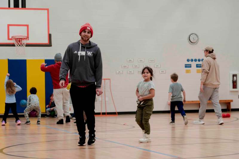 a man and a girl in a gym