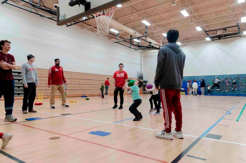 a group of people in a gym