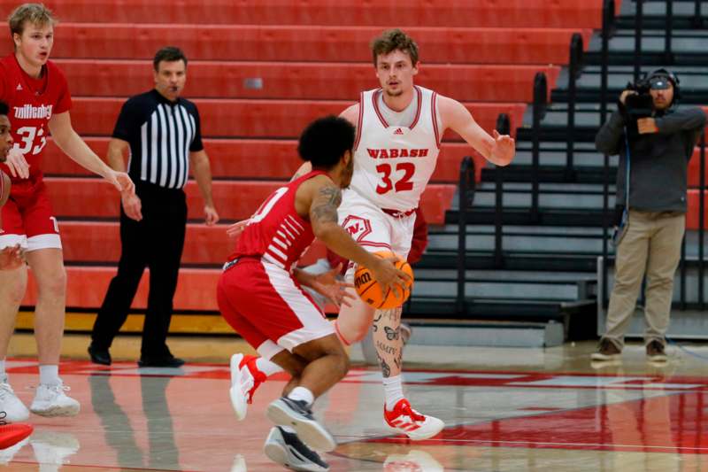 a basketball player dribbling a basketball