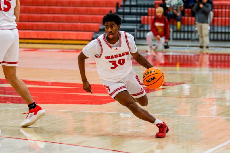 a man running with a basketball