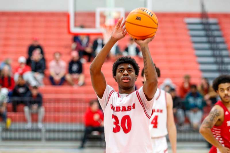 a man in a basketball jersey with a ball in his hand