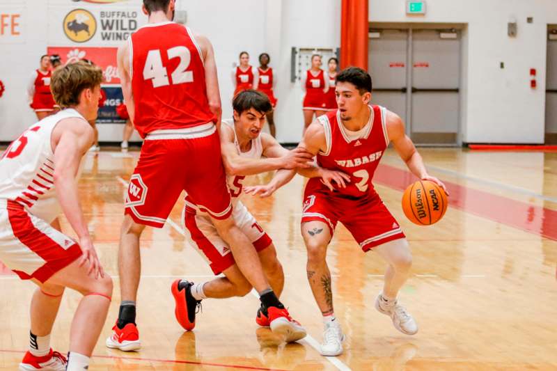 a group of men playing basketball