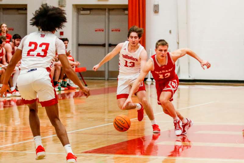 a group of men playing basketball