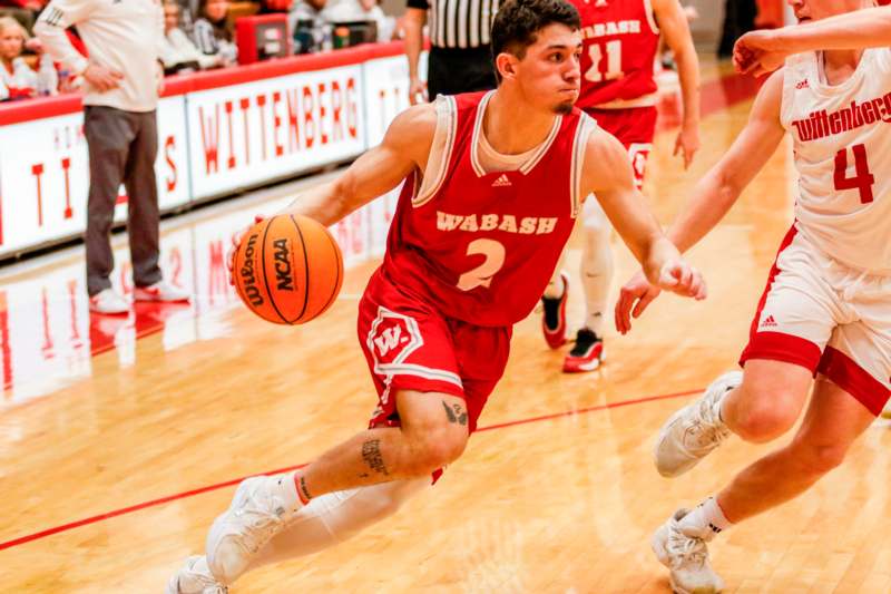 a basketball player dribbling a basketball