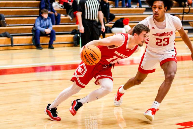 a basketball player dribbling a basketball