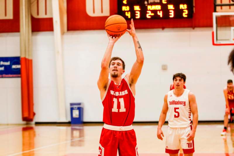 a basketball player in a red uniform