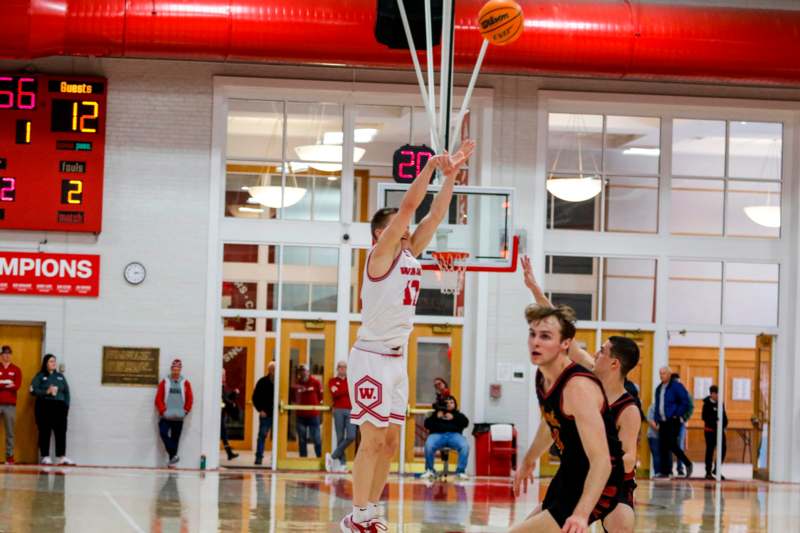 a group of men playing basketball