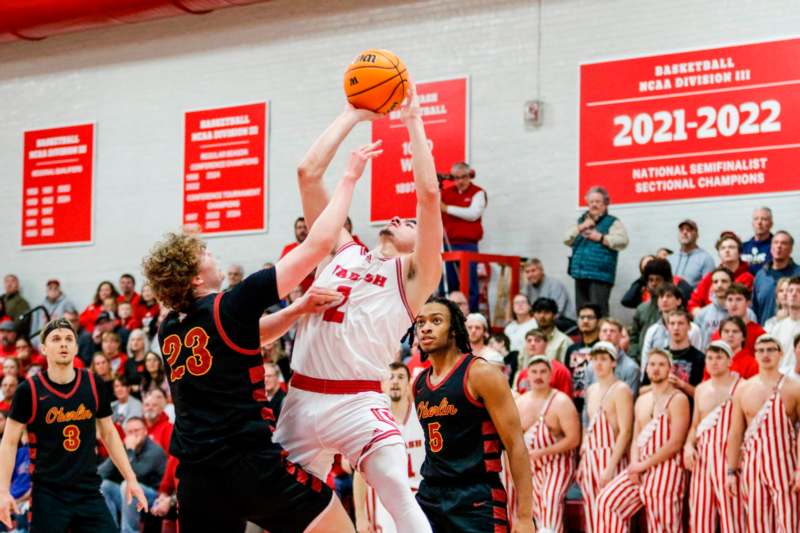 a group of men playing basketball