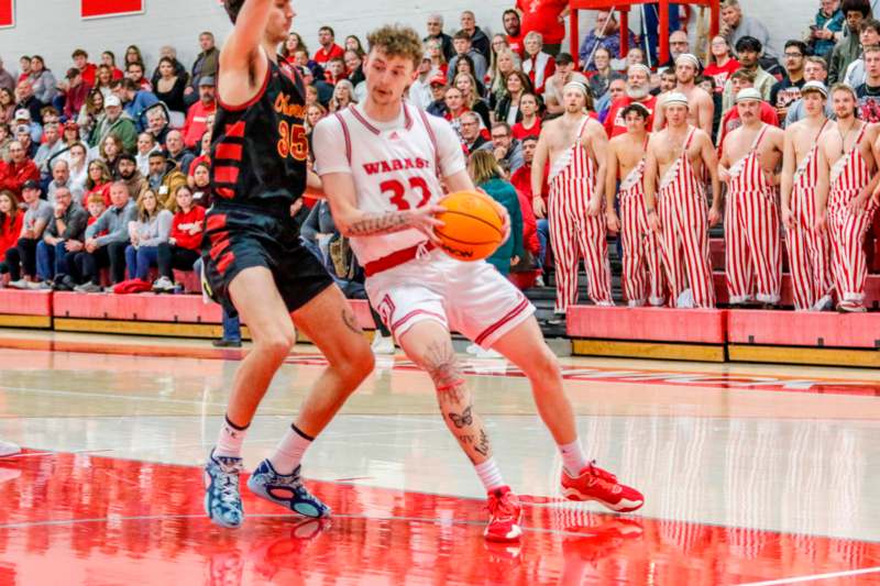 a basketball player dribbling a ball