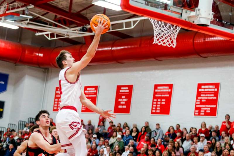 a basketball player dunking a ball