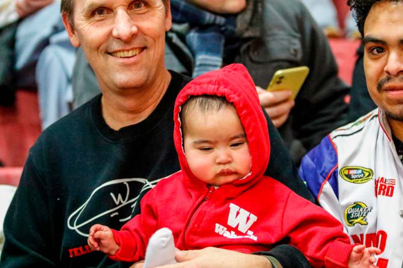 a man holding a baby