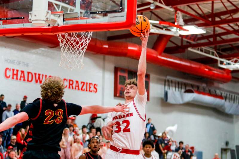 a basketball player in a red and white uniform