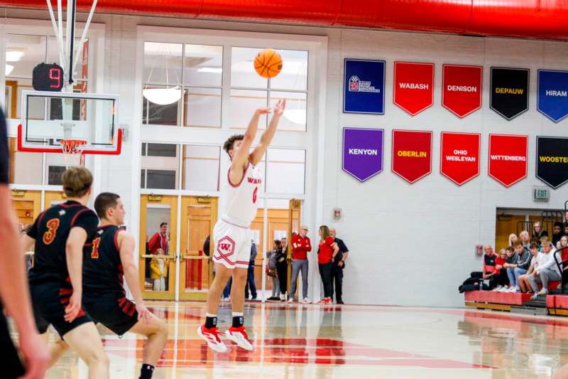 a man jumping to dunk a basketball