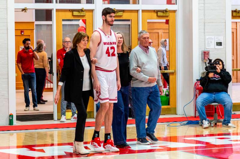 a group of people standing in a gym