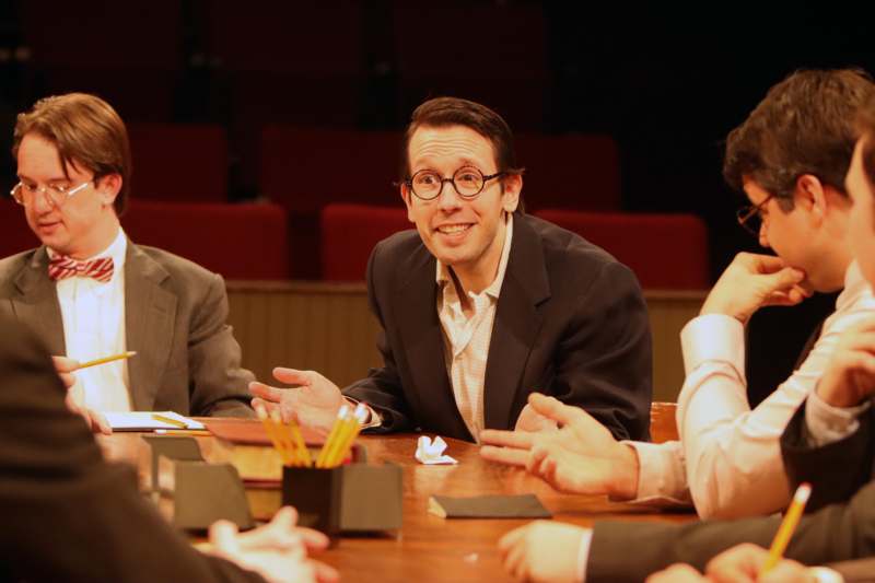 a group of people sitting around a table