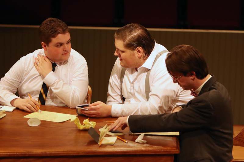 a group of men sitting at a table