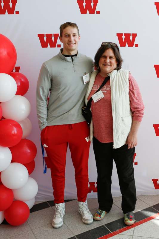 a man and woman standing next to each other