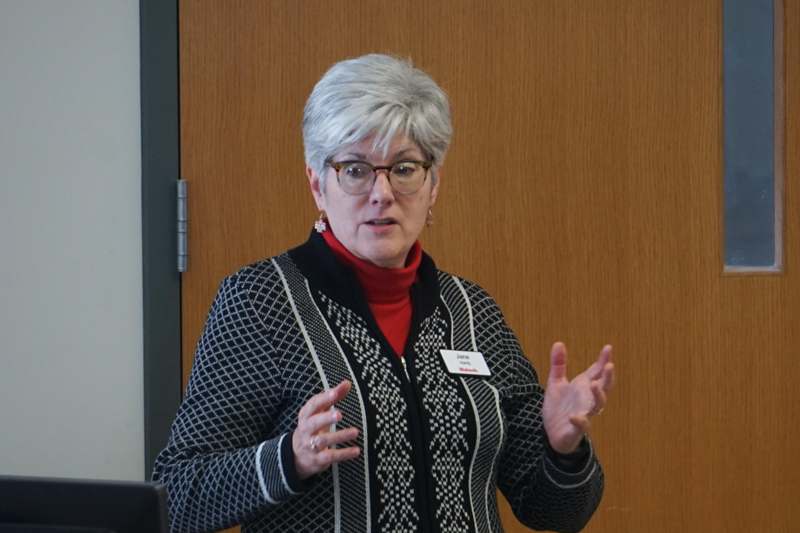 a woman standing in front of a door