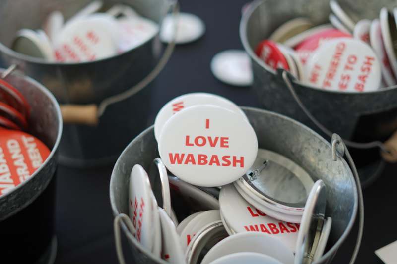 a group of buckets with badges