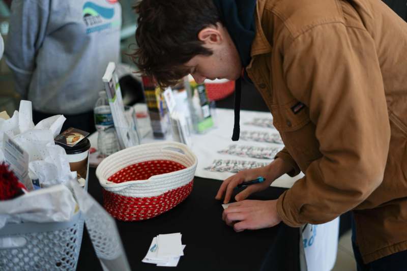 a man writing on a table