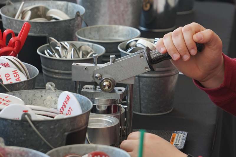 a person using a machine to press objects