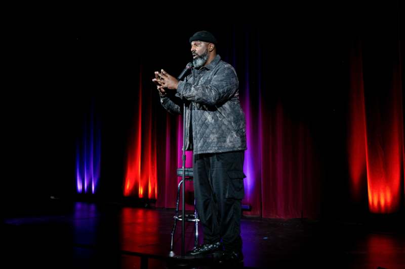 a man standing on a stage with a microphone